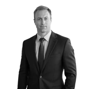 Black and White headshot of CEO John Sarson